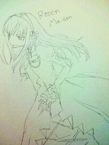 Rating: Safe Score: 0 Tags: 1girl dress elbow_gloves frills hairband image long_hair monochrome puffy_sleeves simple_background smile solo standing suigintou User: admin