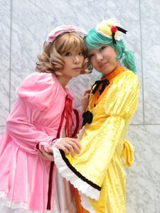 Rating: Safe Score: 0 Tags: 2girls blonde_hair curly_hair dress flower green_hair hat lips multiple_cosplay multiple_girls realistic short_hair tagme yellow_dress User: admin