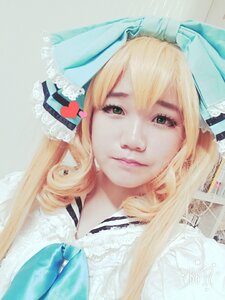 Rating: Safe Score: 0 Tags: 1girl blonde_hair bow closed_mouth green_eyes heart lips long_hair looking_at_viewer ribbon shinku solo User: admin