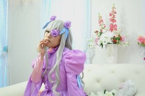 Rating: Safe Score: 0 Tags: 1girl barasuishou blonde_hair dress flower hair_flower hair_ornament long_hair long_sleeves profile purple_dress purple_flower rose solo upper_body water User: admin
