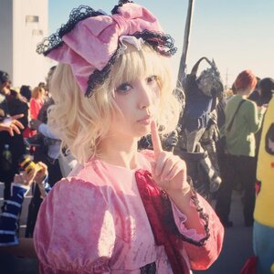 Rating: Safe Score: 0 Tags: 1girl alice_margatroid blonde_hair blurry blurry_foreground capelet depth_of_field dress finger_to_mouth hat hinaichigo lips long_sleeves photo realistic ribbon short_hair solo upper_body User: admin