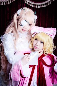 Rating: Safe Score: 0 Tags: 2girls bangs blonde_hair blue_eyes bow eyepatch lips long_hair looking_at_viewer multiple_cosplay multiple_girls realistic ribbon sisters smile tagme twins upper_body User: admin