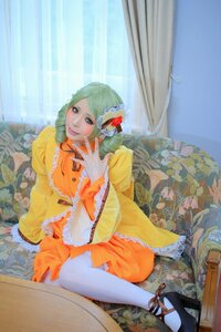 Rating: Safe Score: 0 Tags: 1girl blonde_hair curtains dress drill_hair flower frills hair_ornament kanaria long_hair orange_dress sitting smile solo twin_drills wide_sleeves User: admin
