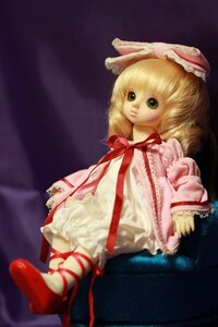 Rating: Safe Score: 0 Tags: 1girl blonde_hair capelet doll dress frills green_eyes hinaichigo looking_at_viewer red_ribbon ribbon short_hair sitting solo User: admin