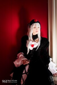 Rating: Safe Score: 0 Tags: 1girl black_dress dress flower frills gothic_lolita long_hair long_sleeves rose solo suigintou white_hair User: admin