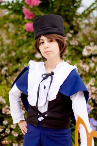 Rating: Safe Score: 0 Tags: 1girl blue_dress blue_headwear blurry blurry_background blurry_foreground brown_eyes brown_hair depth_of_field dress flower hat lips long_sleeves outdoors realistic ribbon short_hair solo souseiseki standing User: admin