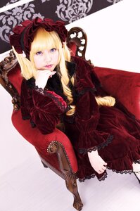 Rating: Safe Score: 0 Tags: 1girl blonde_hair blue_eyes bonnet dress flower frills long_hair long_sleeves looking_at_viewer red_dress rose shinku sitting solo User: admin