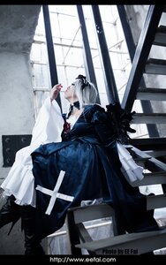 Rating: Safe Score: 0 Tags: 1girl auto_tagged boots dress gun indoors long_hair profile sitting solo suigintou weapon User: admin