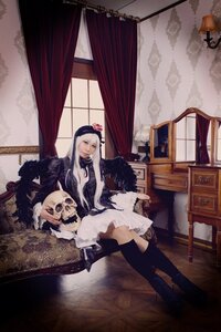 Rating: Safe Score: 0 Tags: 1girl boots breasts cleavage curtains long_hair sitting solo suigintou window User: admin