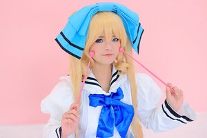 Rating: Safe Score: 0 Tags: 1girl blonde_hair blue_bow blue_eyes blue_neckwear blue_ribbon bow earrings holding lips long_hair long_sleeves nail_polish nose pink_background ribbon shinku solo upper_body User: admin