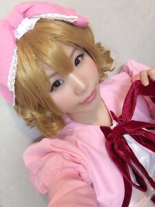 Rating: Safe Score: 0 Tags: 1girl blonde_hair closed_mouth dress drill_hair eyelashes frills hands hat hinaichigo lips looking_at_viewer outstretched_arm photo pink_dress realistic ribbon smile solo upper_body User: admin