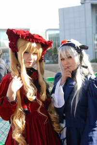 Rating: Safe Score: 0 Tags: 2girls blonde_hair blurry blurry_background bonnet building depth_of_field drill_hair flower long_hair long_sleeves looking_at_another multiple_cosplay multiple_girls shinku smile tagme User: admin
