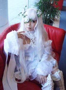 Rating: Safe Score: 0 Tags: 1girl bangs chair closed_mouth couch dress frills green_eyes indoors kirakishou lips long_hair plant potted_plant sitting solo white_hair window User: admin