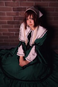 Rating: Safe Score: 0 Tags: 1girl apron blue_eyes brown_hair closed_mouth dress green_dress lips long_sleeves looking_at_viewer sitting solo suiseiseki v_arms User: admin