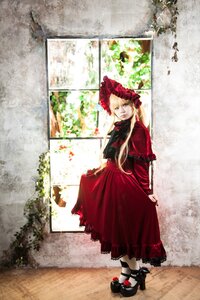 Rating: Safe Score: 0 Tags: 1girl black_footwear blonde_hair blue_eyes bonnet bow dress long_hair long_sleeves looking_at_viewer red_dress shinku shoes solo standing white_legwear window User: admin