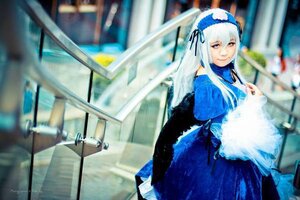 Rating: Safe Score: 0 Tags: 1girl blue_dress blurry blurry_background blurry_foreground depth_of_field dress frills hairband indoors lolita_hairband long_hair long_sleeves photo ribbon smile solo stained_glass standing suigintou white_hair wings User: admin