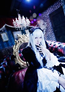 Rating: Safe Score: 0 Tags: 1girl bangs dress hairband indoors lolita_fashion long_hair long_sleeves looking_at_viewer pale_skin purple_eyes sitting solo suigintou white_hair User: admin