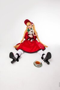 Rating: Safe Score: 0 Tags: 1girl blonde_hair blue_eyes bonnet cat dress food long_hair red_dress shinku sitting solo stuffed_animal User: admin