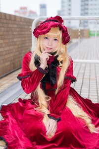 Rating: Safe Score: 0 Tags: 1girl blonde_hair blue_eyes blurry blurry_background building depth_of_field dress flower frills long_hair long_sleeves looking_at_viewer photo red_dress rose shinku sitting solo User: admin