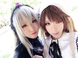 Rating: Safe Score: 0 Tags: 2girls bangs closed_mouth lips long_hair looking_at_viewer multiple_cosplay multiple_girls red_eyes ribbon silver_hair smile suigintou tagme white_hair User: admin