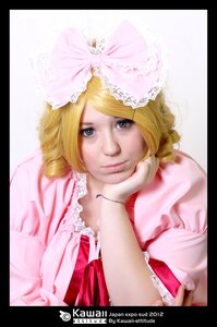 Rating: Safe Score: 0 Tags: 1girl auto_tagged black_border blonde_hair blurry bow depth_of_field frills hat hinaichigo letterboxed lips looking_at_viewer pillarboxed pink_bow realistic ribbon smile solo User: admin