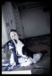 Rating: Safe Score: 0 Tags: 1girl 3d black_border border dress letterboxed lips long_sleeves pale_skin sitting solo suigintou white_hair wings User: admin