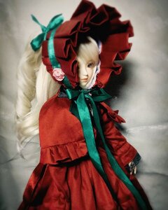 Rating: Safe Score: 0 Tags: 1girl blonde_hair bonnet bow bug doll dress flower gloves green_neckwear long_hair long_sleeves red_capelet red_dress ribbon rose shinku solo standing User: admin