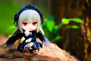 Rating: Safe Score: 0 Tags: 1girl black_wings blurry blurry_background boots chibi depth_of_field doll dress flower frills full_body hairband long_hair long_sleeves looking_at_viewer red_eyes ribbon rose silver_hair sitting solo suigintou wings User: admin