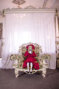 Rating: Safe Score: 0 Tags: 1girl blonde_hair blue_eyes curtains dress flower hood red_dress rose shinku sitting solo User: admin