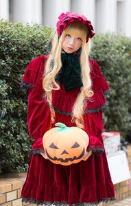 Rating: Safe Score: 0 Tags: 1girl blonde_hair blue_eyes blurry bonnet capelet depth_of_field dress frills holding jack-o'-lantern lips long_hair long_sleeves looking_at_viewer outdoors shinku solo standing User: admin
