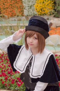Rating: Safe Score: 0 Tags: 1girl blurry brown_eyes brown_hair capelet depth_of_field dress flower hat lips long_sleeves looking_at_viewer outdoors short_hair solo souseiseki User: admin