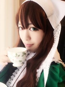 Rating: Safe Score: 0 Tags: 1girl bangs brown_hair closed_mouth coffee cup hat holding holding_cup lips looking_at_viewer simple_background smile solo suiseiseki teacup upper_body User: admin