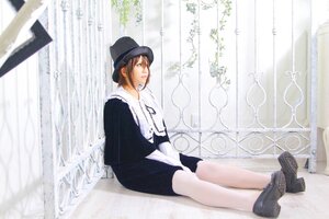 Rating: Safe Score: 0 Tags: 1girl black_footwear black_shorts brown_hair curtains from_side hat long_sleeves shoes short_hair sitting solo window User: admin