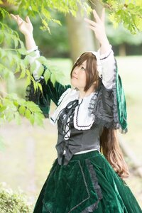 Rating: Safe Score: 0 Tags: 1girl arms_up brown_hair dress frills green_eyes long_hair long_sleeves ribbon solo standing suiseiseki very_long_hair User: admin