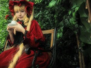 Rating: Safe Score: 0 Tags: 1girl blonde_hair blue_eyes bonnet bow dress drill_hair flower lips long_hair long_sleeves realistic red_dress rose shinku sitting solo User: admin