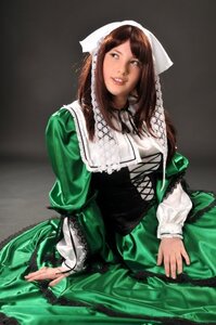 Rating: Safe Score: 0 Tags: 1girl bangs brown_hair corset dress green_dress head_scarf long_sleeves sitting solo suiseiseki User: admin