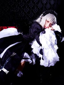 Rating: Safe Score: 0 Tags: 1girl black_background dress flower frills hairband long_hair long_sleeves looking_at_viewer red_eyes solo suigintou veil white_hair User: admin