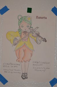 Rating: Safe Score: 0 Tags: 1girl ahoge bow dress english_text full_body green_eyes green_hair image kanaria long_sleeves personification photo shoes solo standing traditional_media yellow_dress User: admin