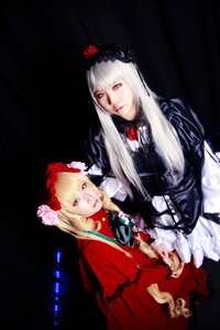 Rating: Safe Score: 0 Tags: 2girls 91076 black_background blonde_hair blue_eyes bonnet dress flower lips long_hair long_sleeves looking_at_viewer multiple_cosplay multiple_girls realistic red_dress rose shinku tagme User: admin