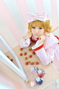 Rating: Safe Score: 0 Tags: 1girl blonde_hair blue_eyes dress flower food fruit hinaichigo lips long_sleeves ribbon rose short_hair sitting solo strawberry table User: admin