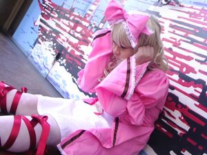 Rating: Safe Score: 0 Tags: 1girl blonde_hair bow city dress frills hair_bow hina_ichigo hinaichigo outdoors pink_bow pink_dress sitting solo umbrella User: admin