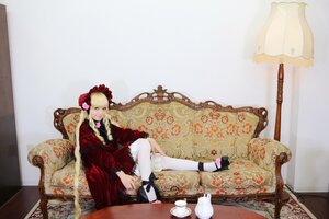 Rating: Safe Score: 0 Tags: 1girl blonde_hair bonnet couch cup dress frills lolita_fashion long_hair shinku shoes sitting solo teacup User: admin