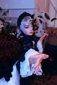 Rating: Safe Score: 0 Tags: 1girl bird blurry depth_of_field dress feathers frills gothic_lolita holding lips long_sleeves looking_at_viewer outstretched_arm outstretched_hand solo suigintou User: admin