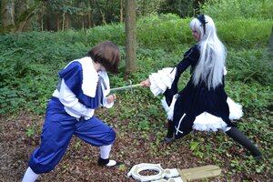 Rating: Safe Score: 0 Tags: 1boy 1girl brown_hair bush day dress frills grass long_hair long_sleeves multiple_cosplay outdoors sitting standing tagme tree User: admin