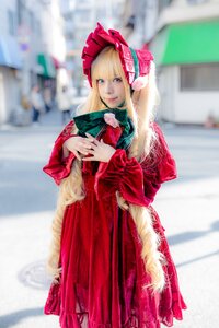 Rating: Safe Score: 0 Tags: 1girl 3d blonde_hair blue_eyes blurry blurry_background blurry_foreground bonnet depth_of_field dress long_hair looking_at_viewer photo red_dress shinku smile solo standing User: admin