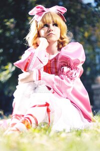 Rating: Safe Score: 0 Tags: 1girl blonde_hair blurry depth_of_field dress flower grass hat hinaichigo puffy_sleeves ribbon short_hair sitting solo User: admin