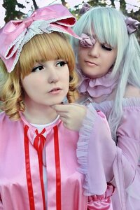 Rating: Safe Score: 0 Tags: 2girls bangs blonde_hair blunt_bangs bow closed_eyes dress drill_hair eyepatch frills hair_bow hina_ichigo lips long_hair multiple_cosplay multiple_girls nose realistic ribbon tagme User: admin