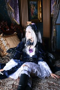 Rating: Safe Score: 0 Tags: 1girl boots dress flower frills gothic_lolita long_sleeves silver_hair sitting solo suigintou User: admin