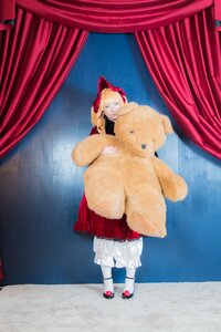 Rating: Safe Score: 0 Tags: 1girl blonde_hair blue_eyes bow curtains dress indoors shinku solo standing stuffed_animal teddy_bear white_legwear window User: admin