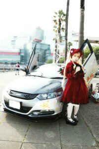Rating: Safe Score: 0 Tags: 1girl car dress ground_vehicle gun motor_vehicle outdoors red_dress red_hair road shinku solo standing street User: admin
